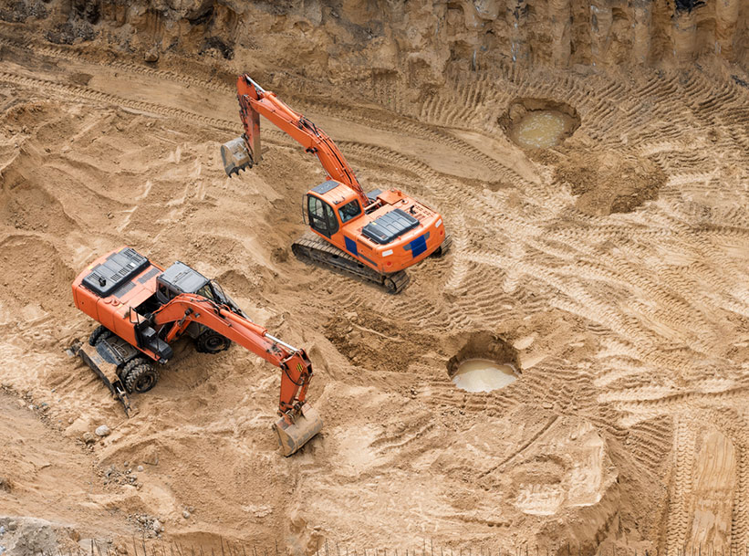 Excavators at sandpit during earthmoving works — Civil Earthmoving in the Whitsunday Region, QLD