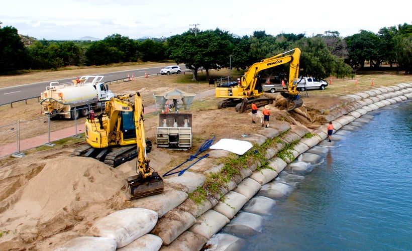Earthmoving Equipment Moving Sandbags — Hillery Group in Richmond Road Bowen, QLD